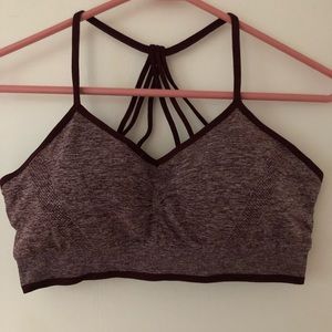 Sports bra with cup pads. Never worn- Tried on, didn’t like.